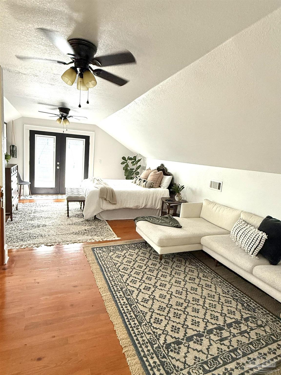 6855 Pine Street Milton, FL 32570 - Photo 26 of 31 a living room with furniture and a rug