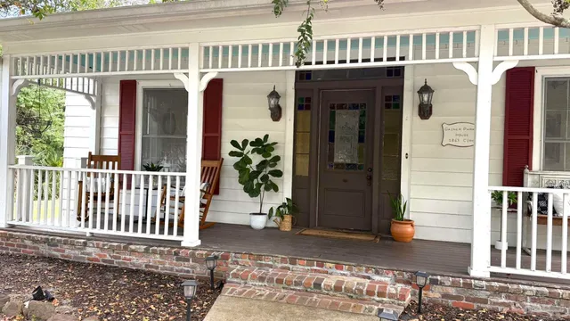 a front view of a house with a porch