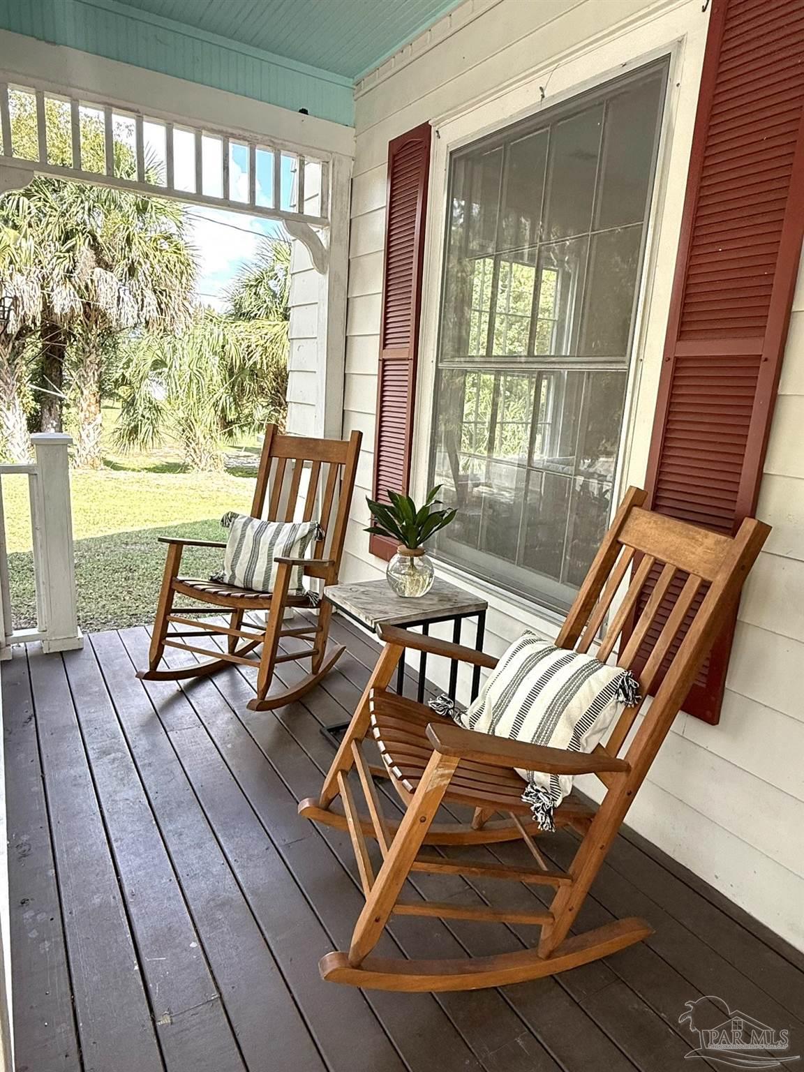 6855 Pine Street Milton, FL 32570 - Photo 6 of 31 a view of a room with wooden floor and windows