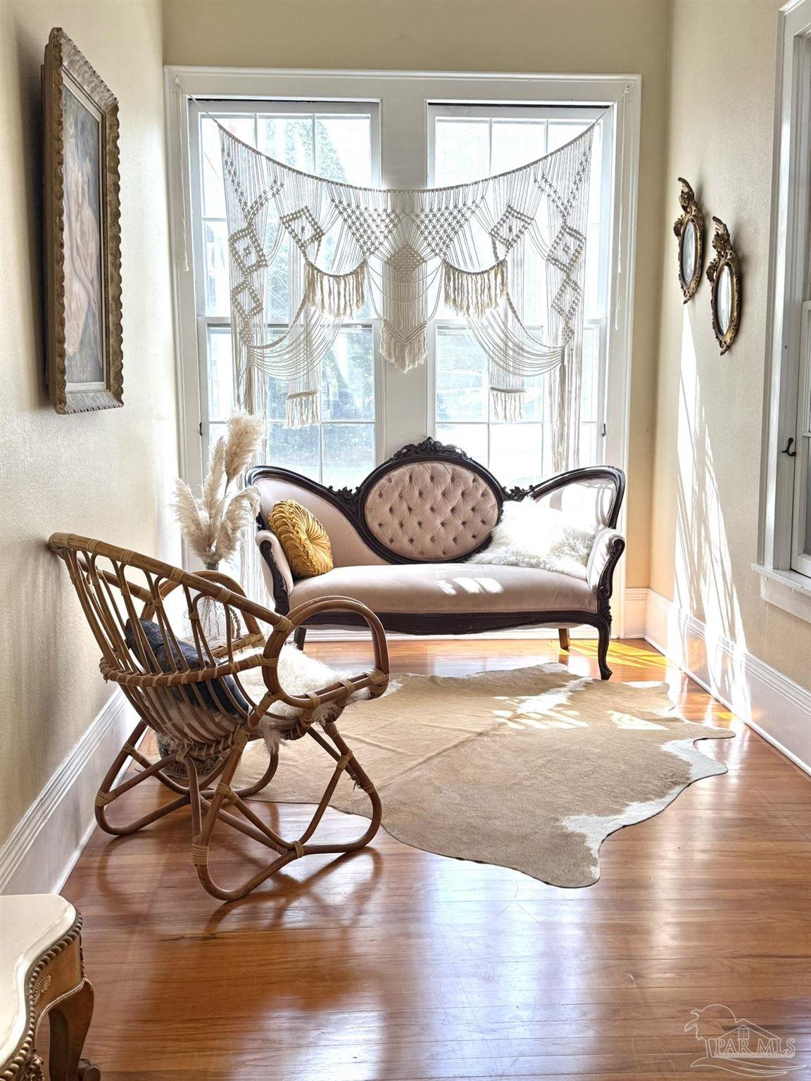 6855 Pine Street Milton, FL 32570 - Photo 8 of 31 a view of a dining room with furniture and wooden floor