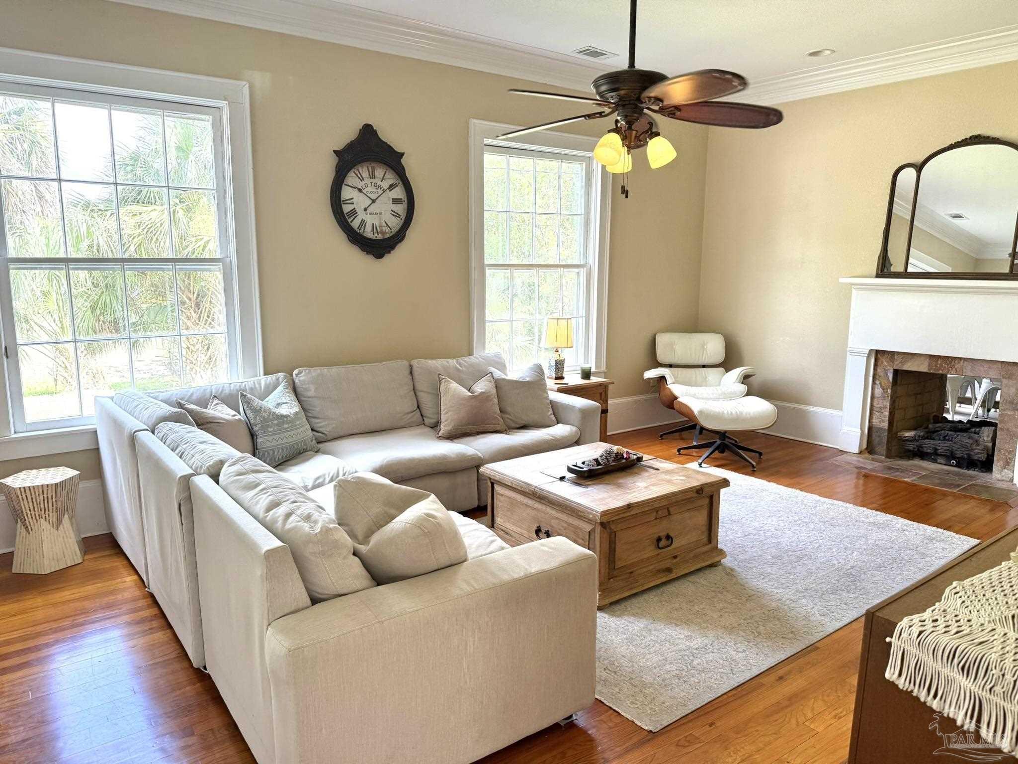 6855 Pine Street Milton, FL 32570 - Photo 9 of 31 a living room with furniture a window and a fireplace