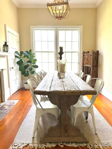 a view of a dining room with furniture and a window