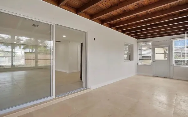 a view of an empty room with a balcony