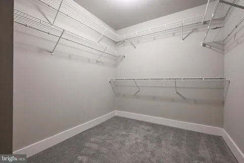 a view of a room with racks on the wall