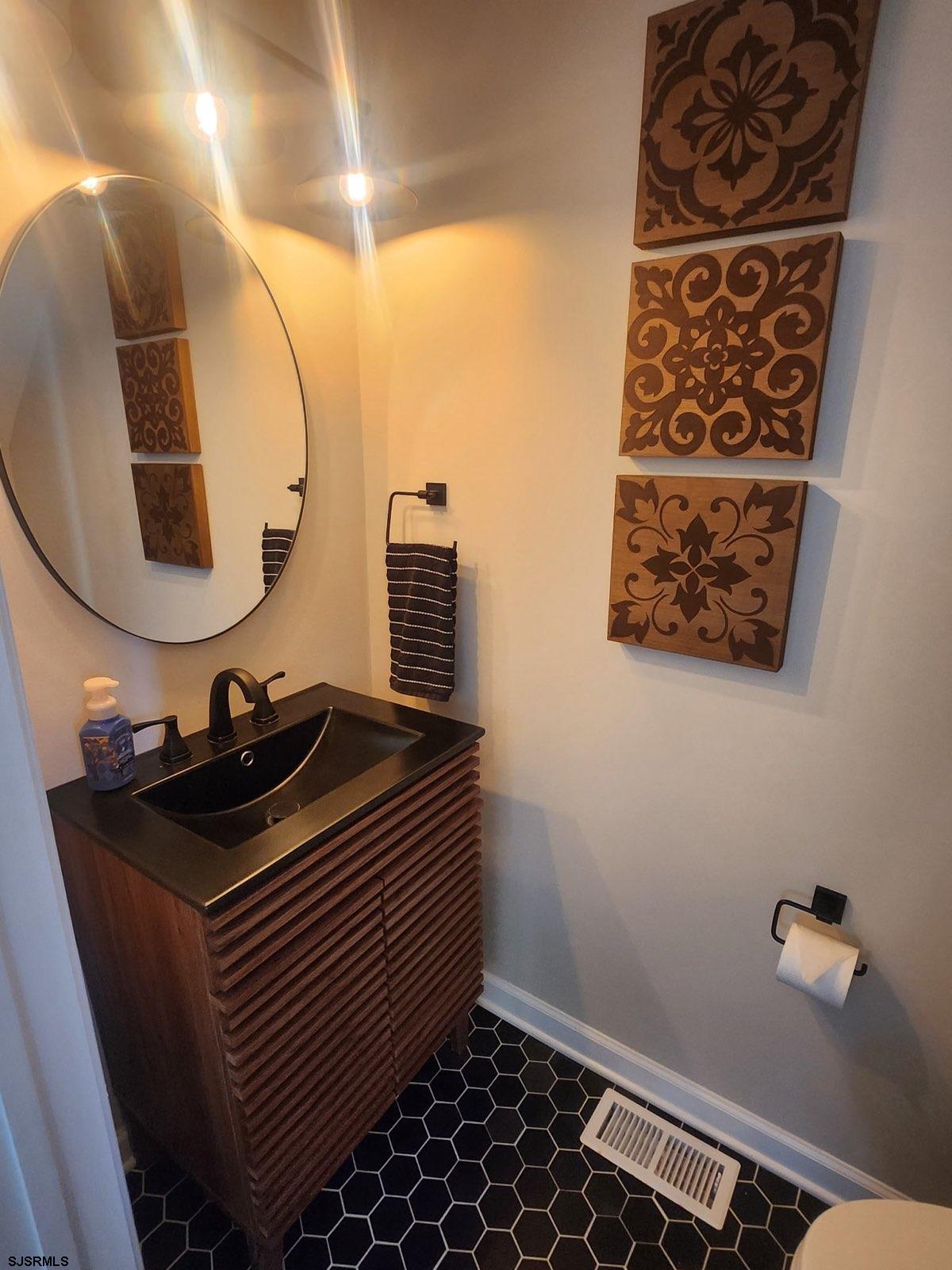 330 Gull Cove Brigantine, NJ 08203 - Photo 15 of 34 a bathroom with a sink and a mirror