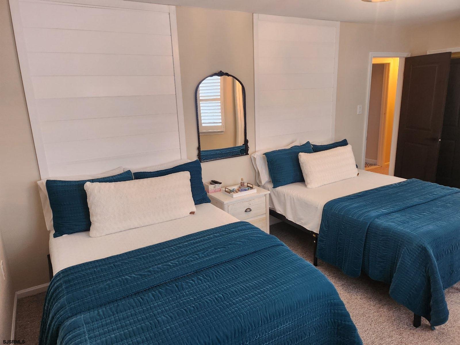 330 Gull Cove Brigantine, NJ 08203 - Photo 17 of 34 a bedroom with a bed and a dresser