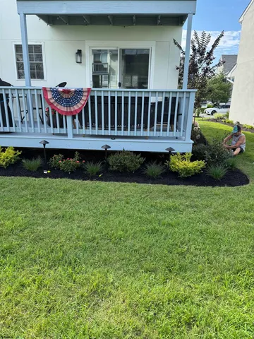 a view of backyard with deck and seating