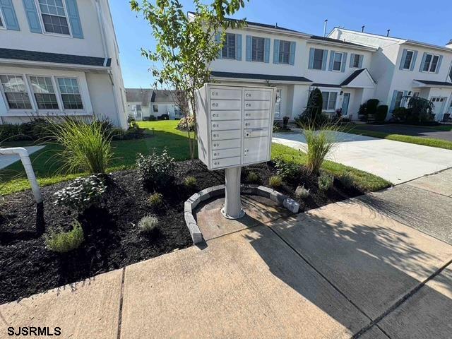 330 Gull Cove Brigantine, NJ 08203 - Photo 3 of 34 a front view of a house with garden and porch