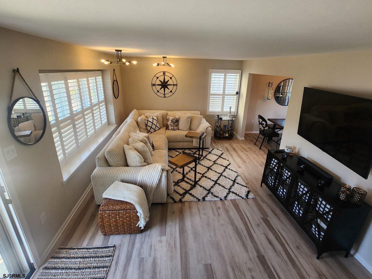 330 Gull Cove Brigantine, NJ 08203 - Photo 6 of 34 a living room with furniture and a flat screen tv