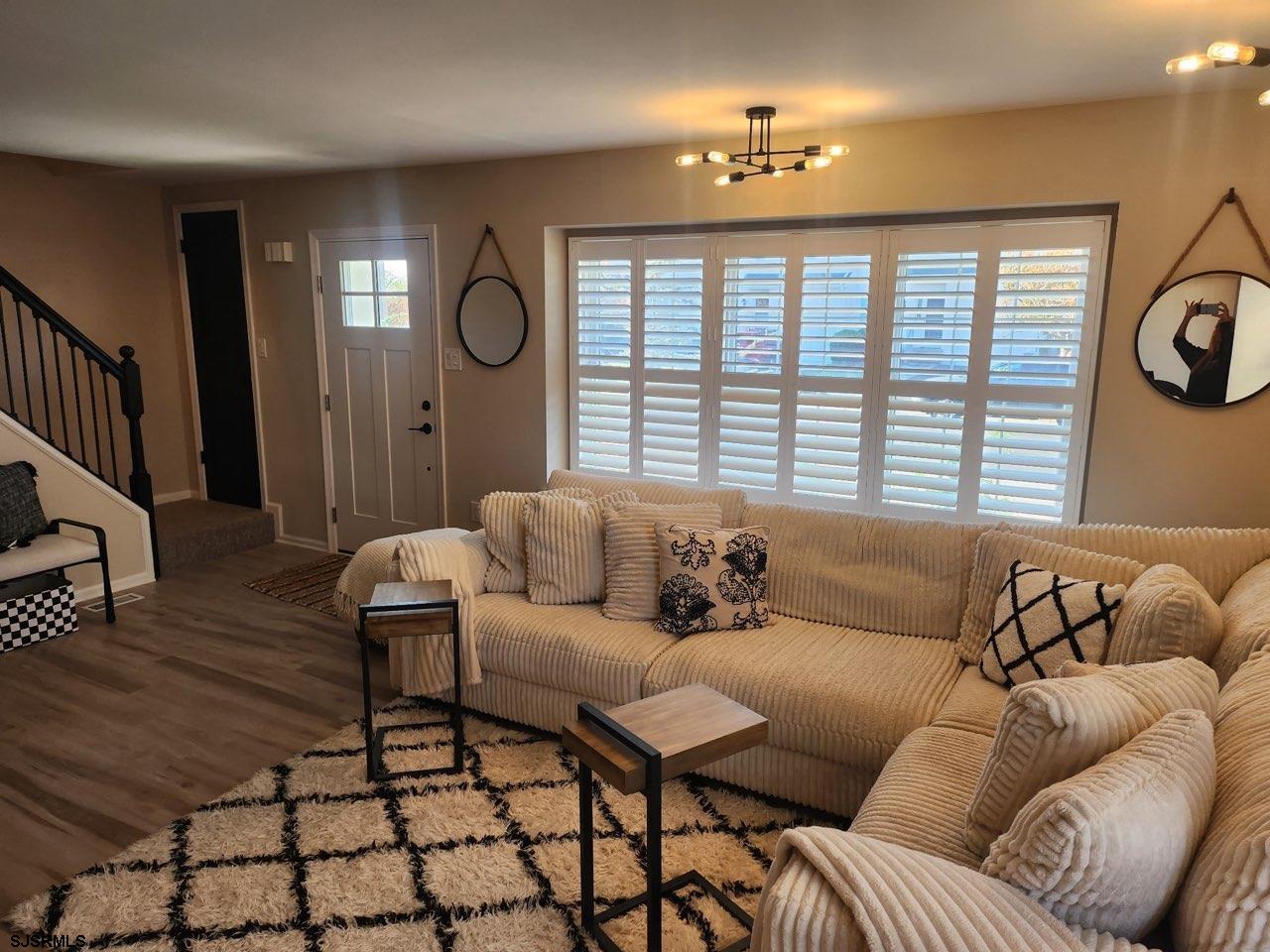 330 Gull Cove Brigantine, NJ 08203 - Photo 7 of 34 a living room with furniture and a large window