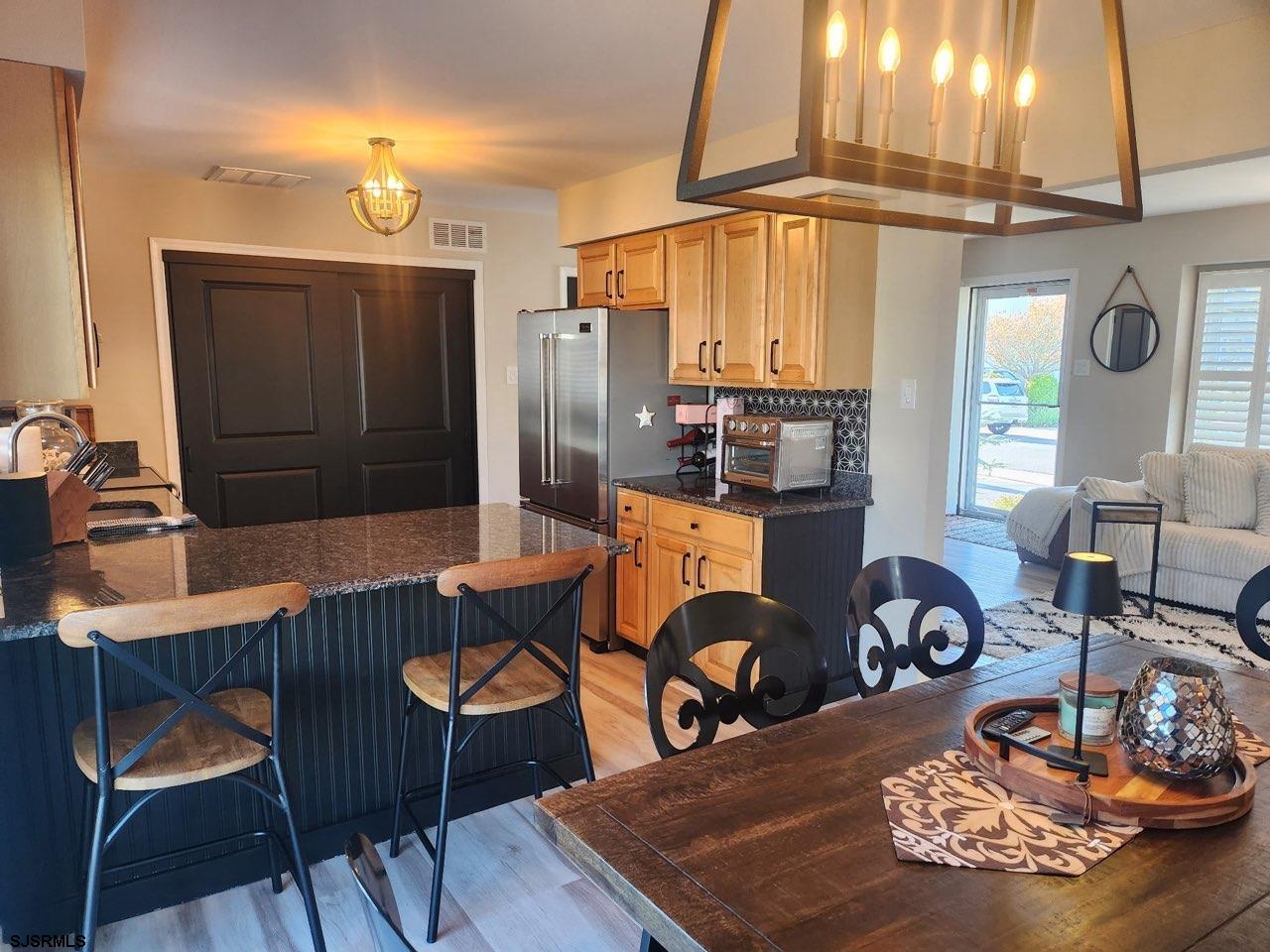 330 Gull Cove Brigantine, NJ 08203 - Photo 10 of 34 a dining room with furniture and wooden floor