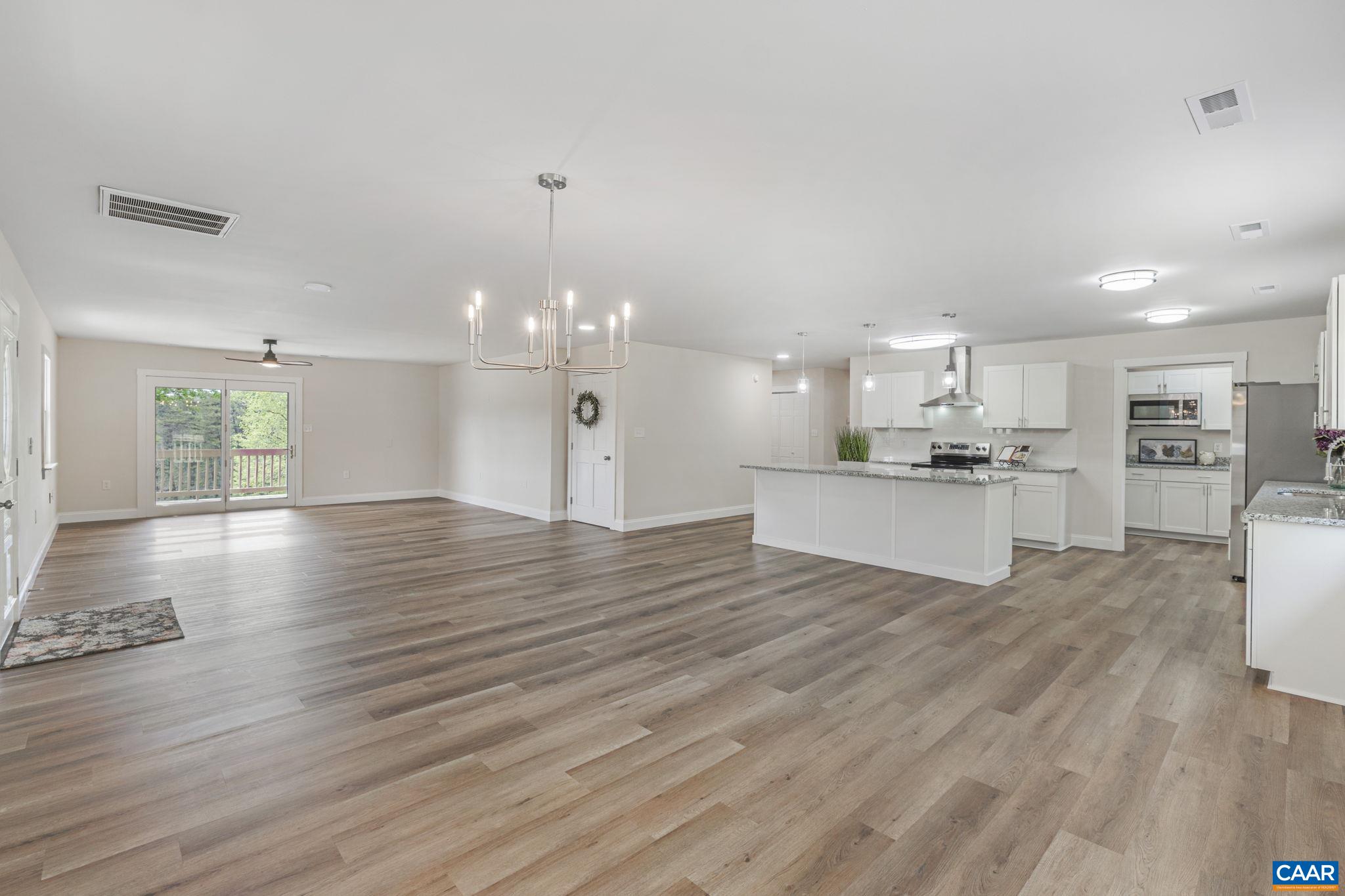 115 Montview Drive Ruckersville, VA 22968 - Photo 11 of 55 a view of kitchen and kitchen with furniture wooden floor and window