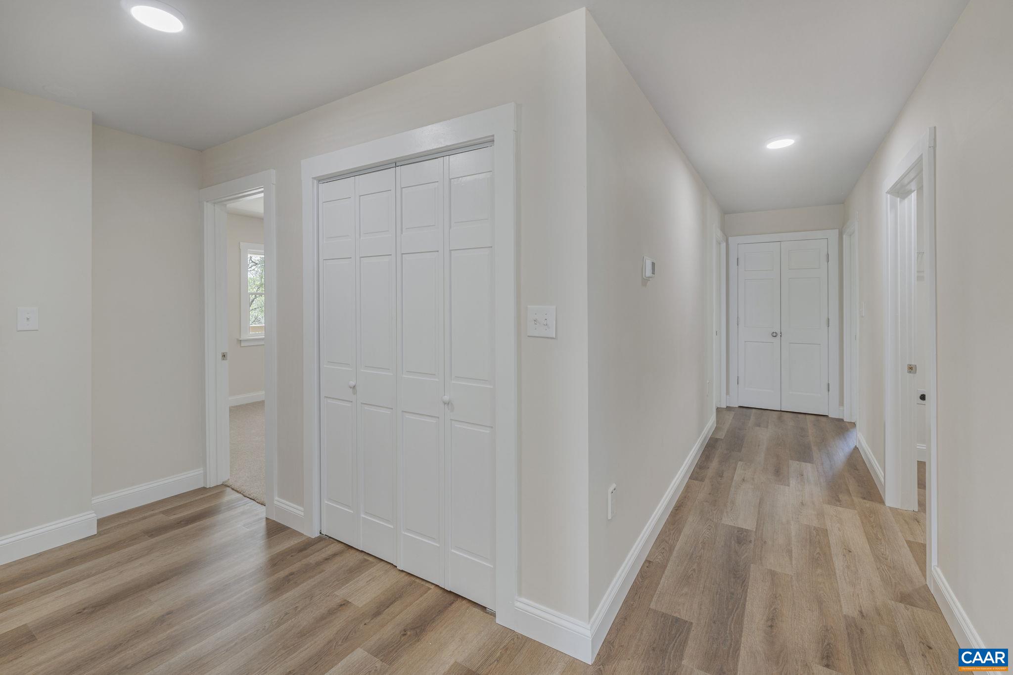115 Montview Drive Ruckersville, VA 22968 - Photo 20 of 55 a view of a hallway with wooden floor