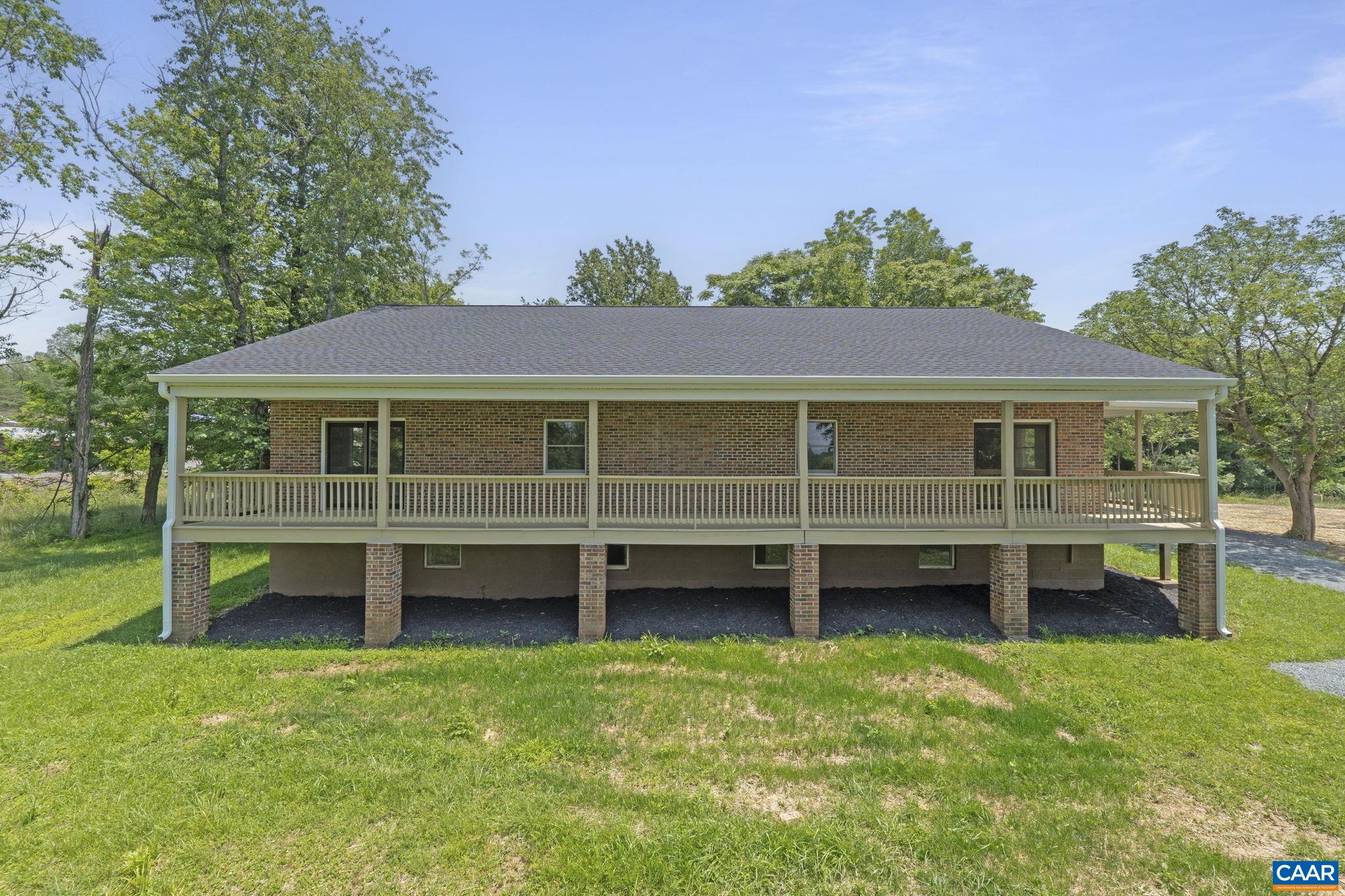 115 Montview Drive Ruckersville, VA 22968 - Photo 46 of 55 an aerial view of a house with a garden and deck