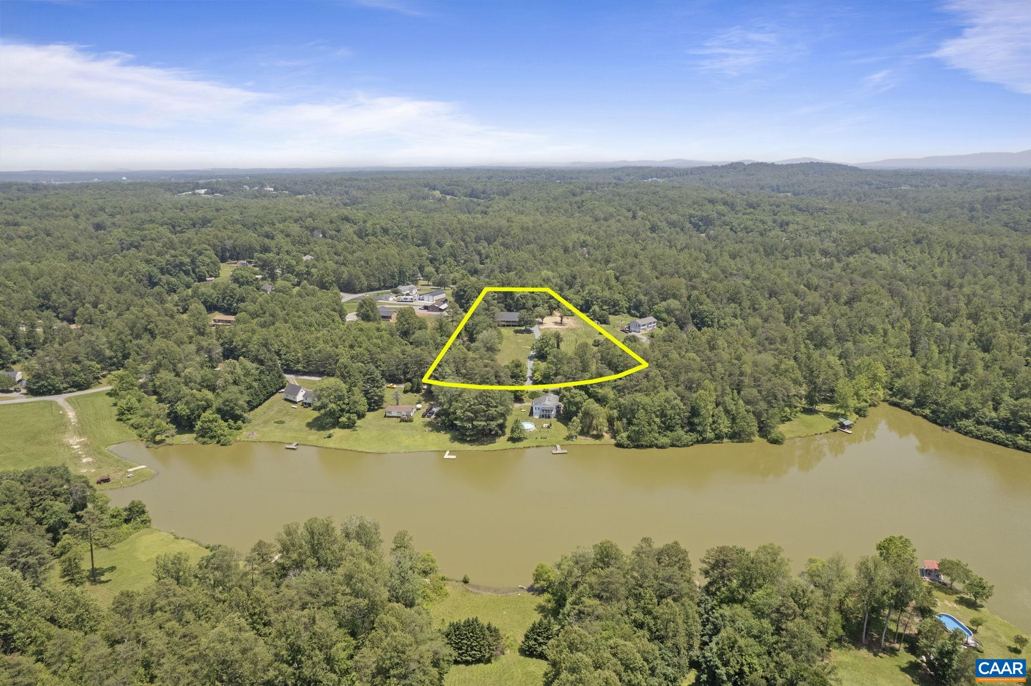 115 Montview Drive Ruckersville, VA 22968 - Photo 50 of 55 a view of a lake with a yard