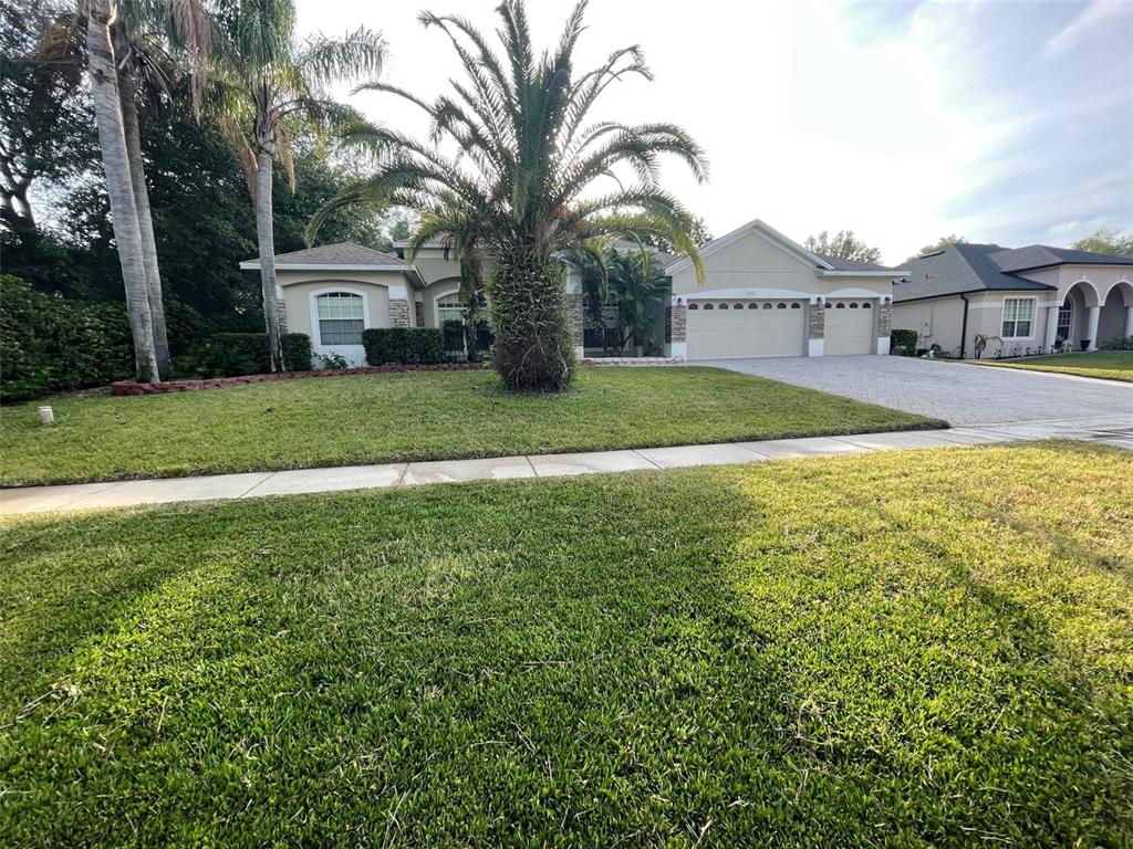 a view of a house with a yard