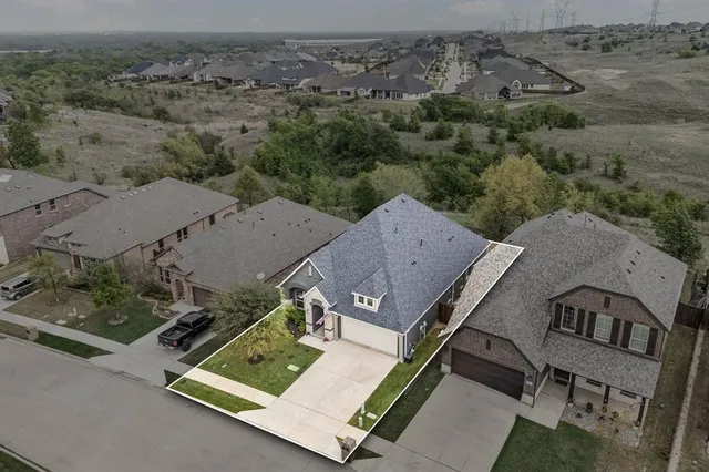 an aerial view of a house with a mountain view