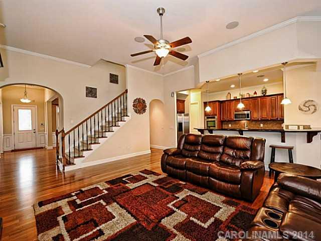 342 Miners Cove Way Fort Mill, SC 29708 - Photo 5 of 16 a living room with furniture and wooden floor