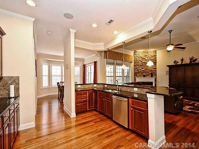 342 Miners Cove Way Fort Mill, SC 29708 - Photo 8 of 16 a kitchen with stainless steel appliances granite countertop a stove and a wooden floors