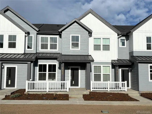 a front view of a house with a garage