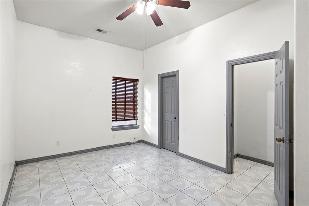 6524 Fair Road Kaufman, TX 75142 - Photo 21 of 30 a view of an empty room with window and chandelier fan
