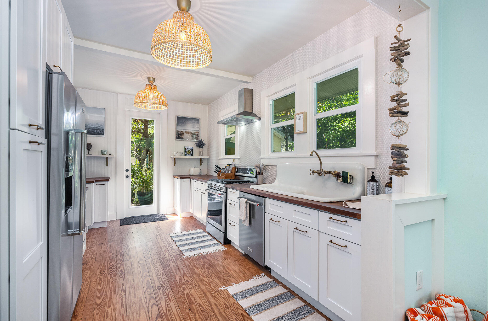 703 Shady Lane Melbourne, FL 32935 - Photo 11 of 23 a kitchen with stainless steel appliances granite countertop a sink stove and refrigerator