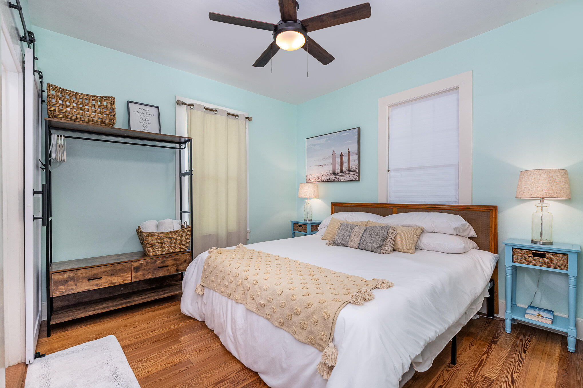 703 Shady Lane Melbourne, FL 32935 - Photo 14 of 23 a bedroom with a bed and wooden floor