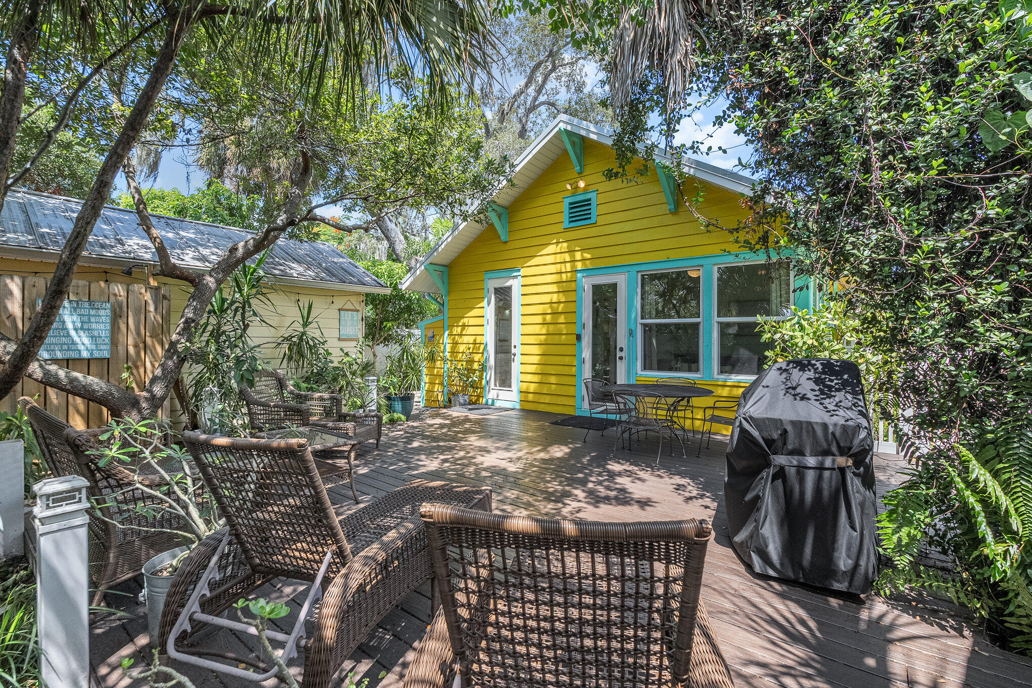 703 Shady Lane Melbourne, FL 32935 - Photo 21 of 23 a front view of house with yard and trees around