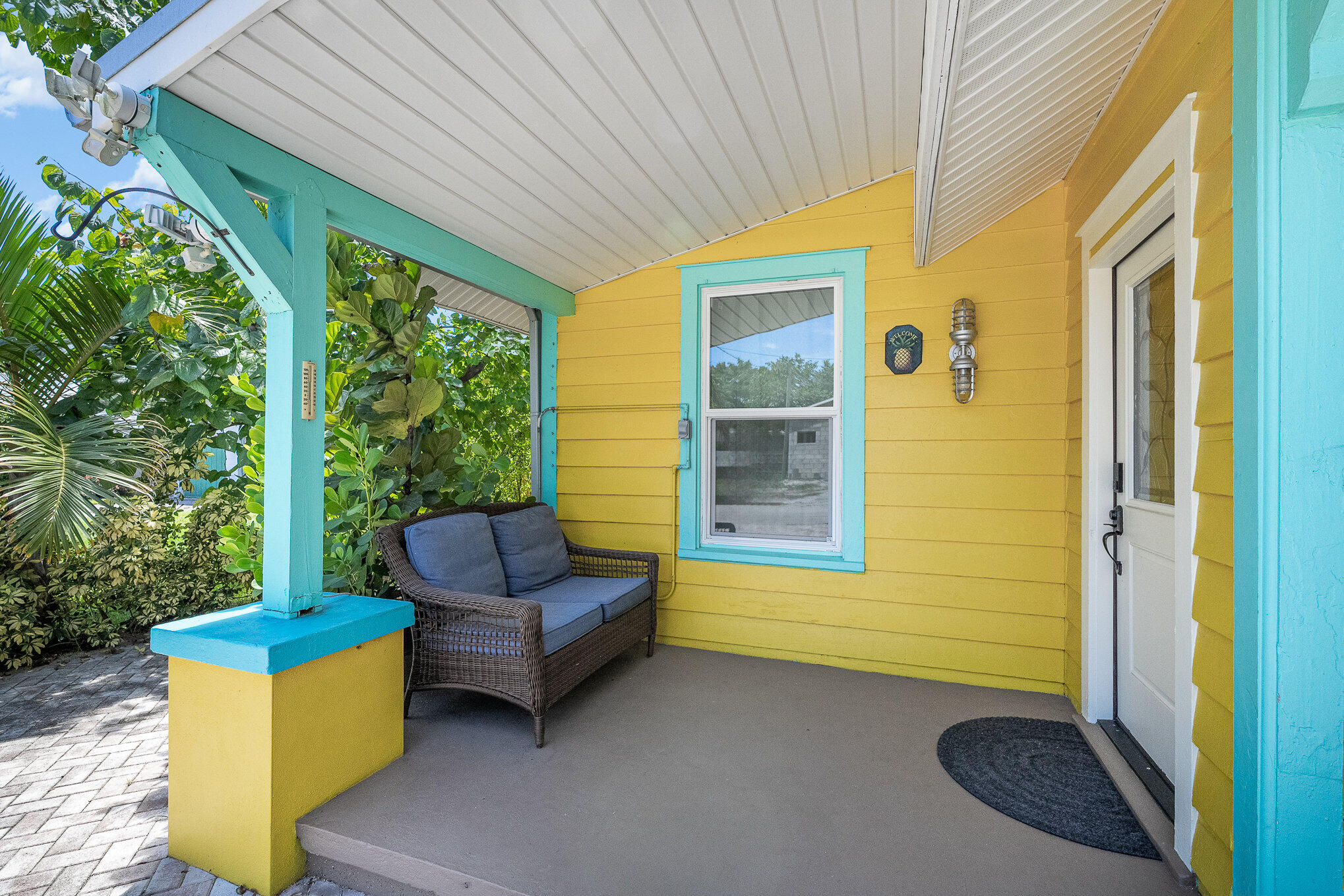 703 Shady Lane Melbourne, FL 32935 - Photo 5 of 23 a backyard of a house with outdoor seating