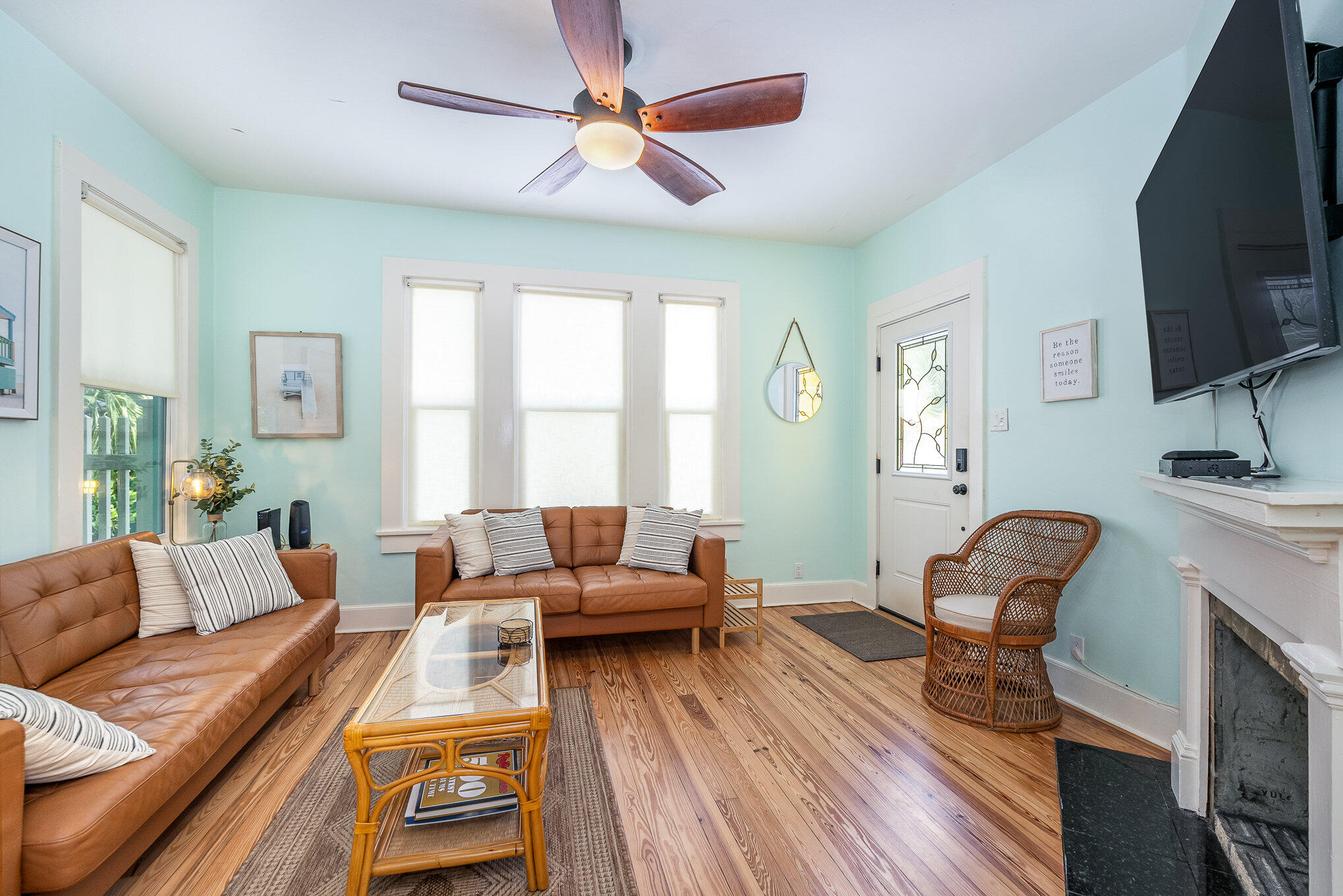 703 Shady Lane Melbourne, FL 32935 - Photo 8 of 23 a living room with furniture fireplace and a flat screen tv