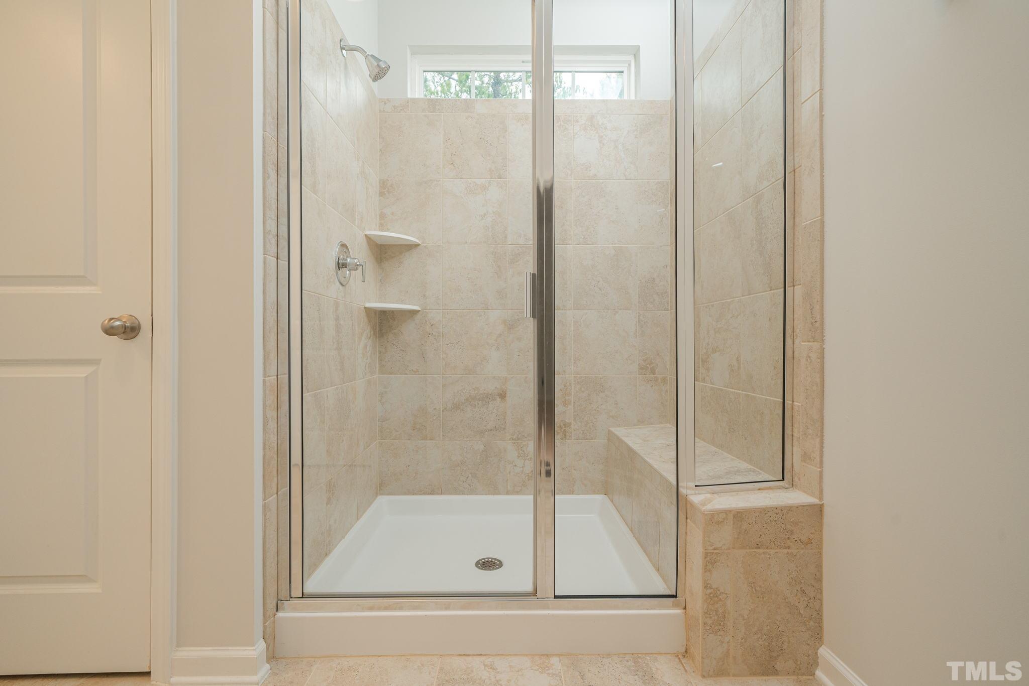 6075 Beale Loop Raleigh, NC 27616 - Photo 14 of 23 a bathroom with a shower