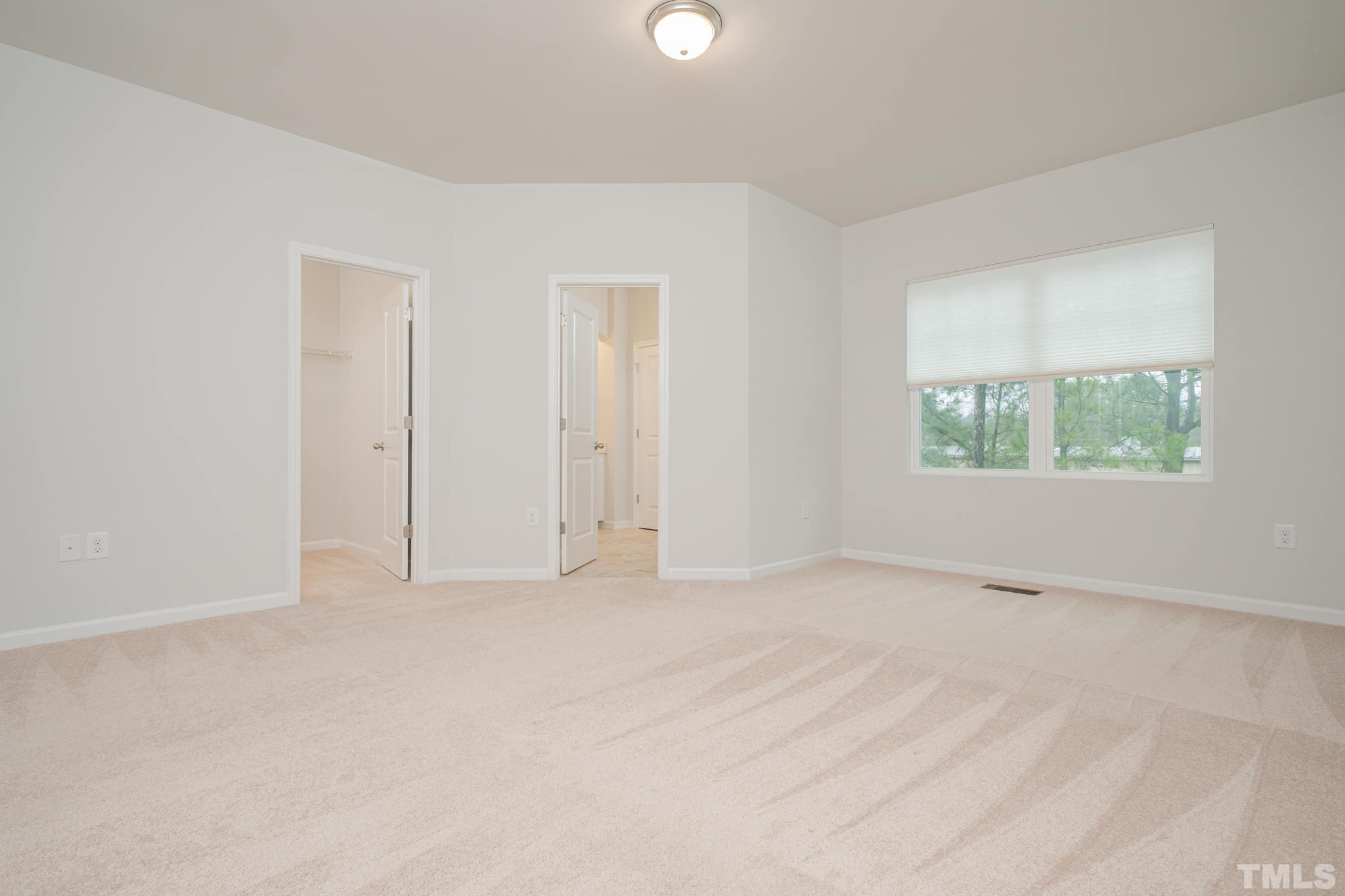 6075 Beale Loop Raleigh, NC 27616 - Photo 15 of 23 an empty room with windows and closet