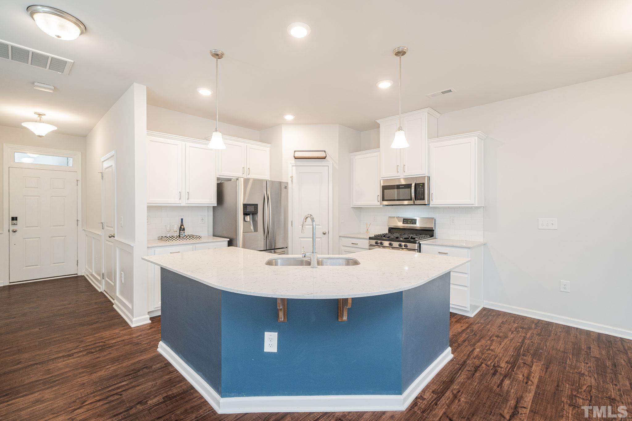 6075 Beale Loop Raleigh, NC 27616 - Photo 7 of 23 a view of kitchen with wooden floor