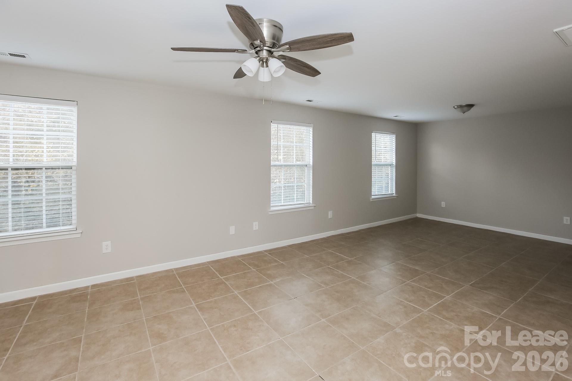 8812 Cornwall Street Locust, NC 28097 - Photo 8 of 15 a view of an empty room with a window