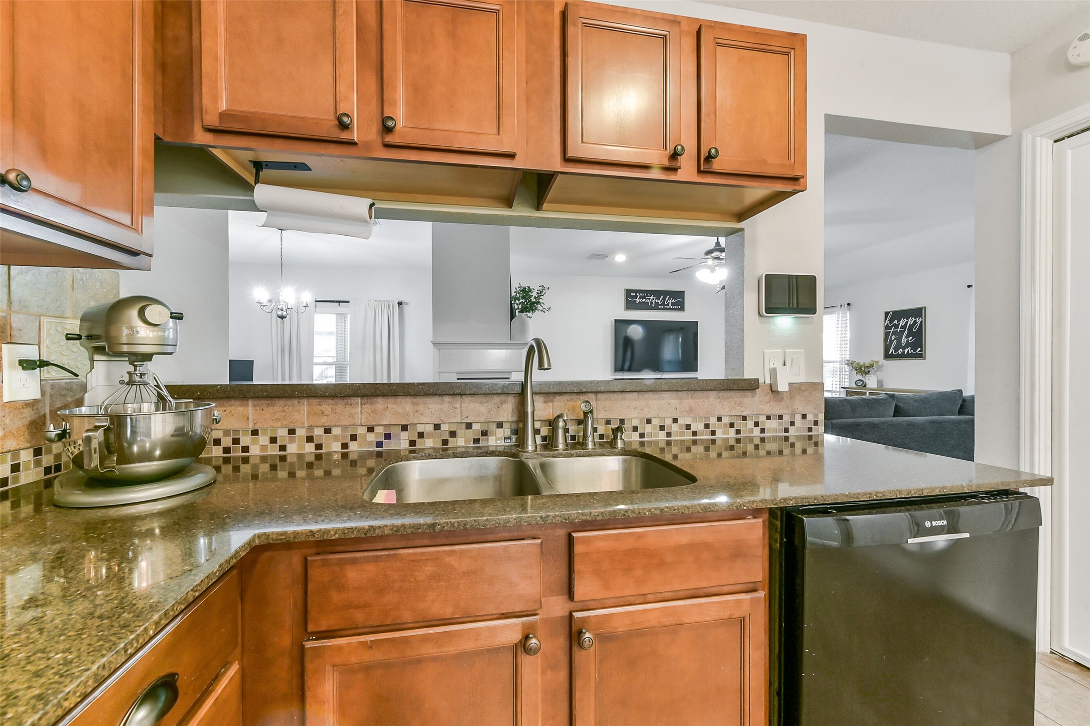 4010 Spring Branch Drive West Pearland, TX 77584 - Photo 14 of 35 a kitchen with stainless steel appliances granite countertop a sink and cabinets