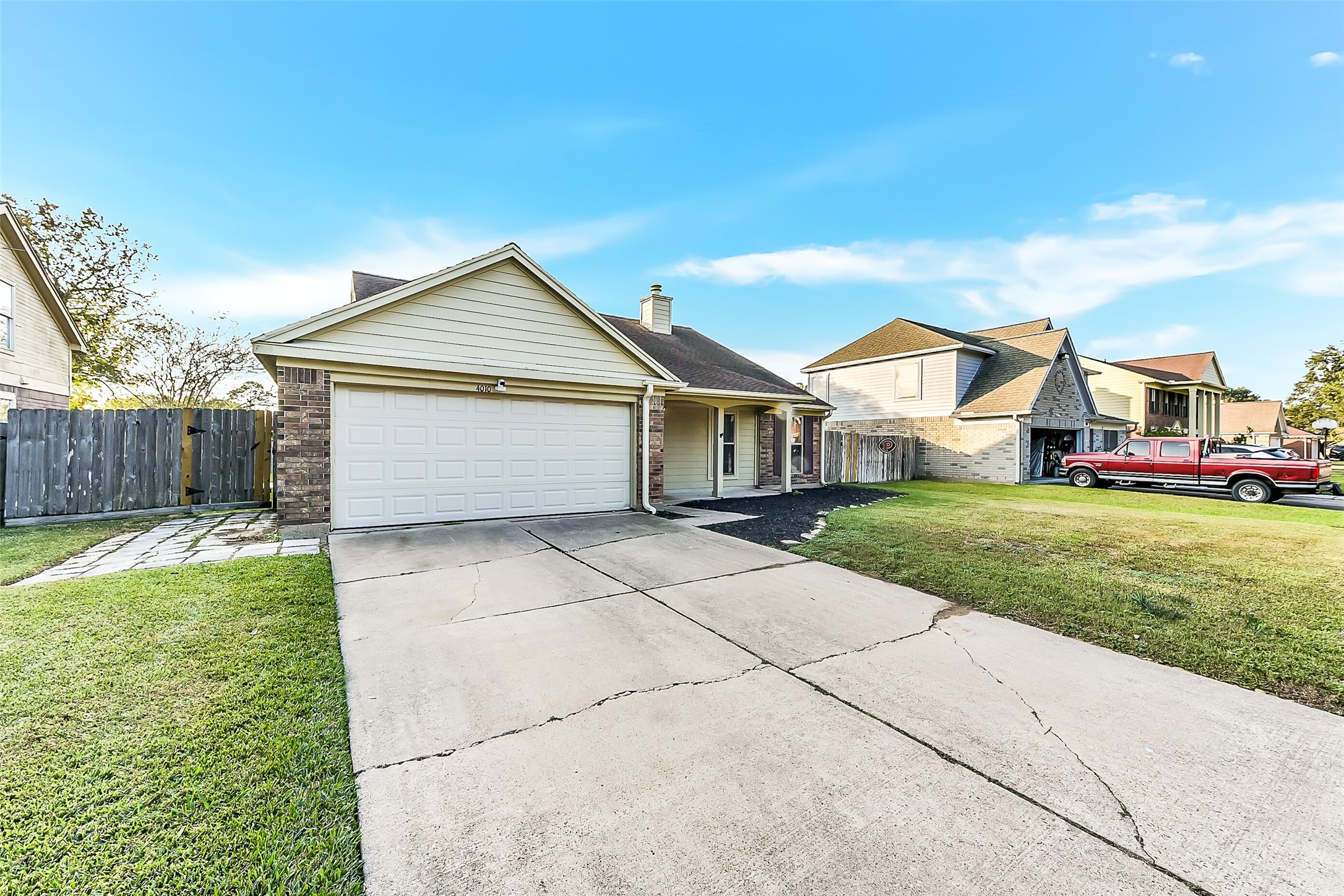 4010 Spring Branch Drive West Pearland, TX 77584 - Photo 2 of 35 a front view of a house with a yard and garage