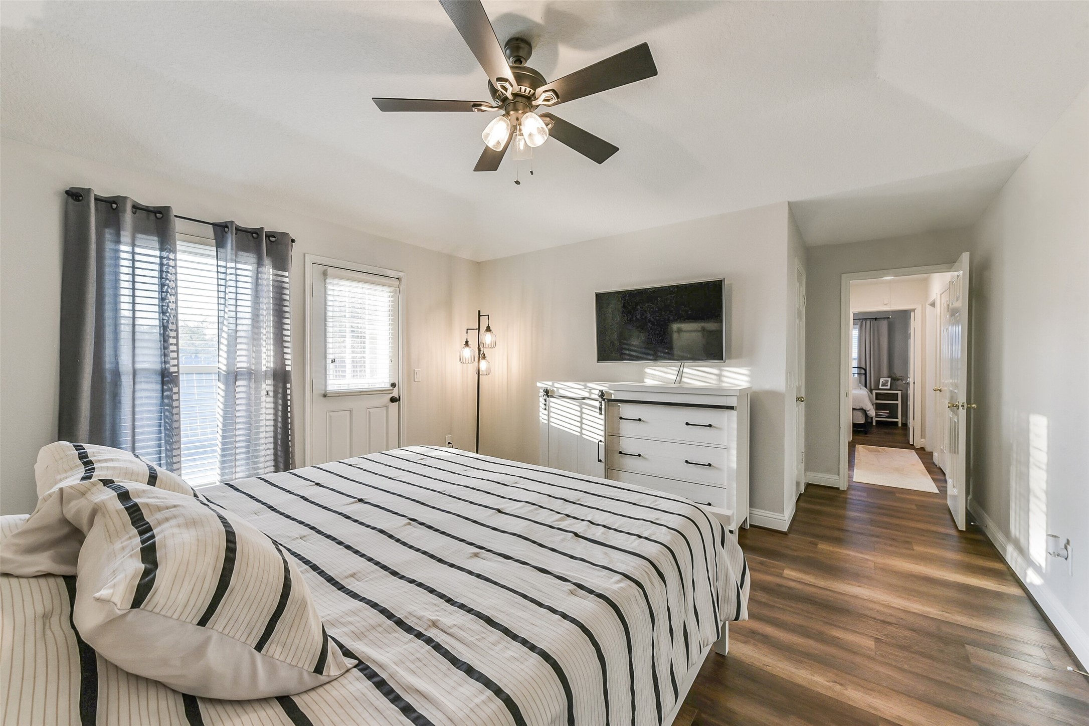 4010 Spring Branch Drive West Pearland, TX 77584 - Photo 21 of 35 a bedroom with a bed and a flat screen tv