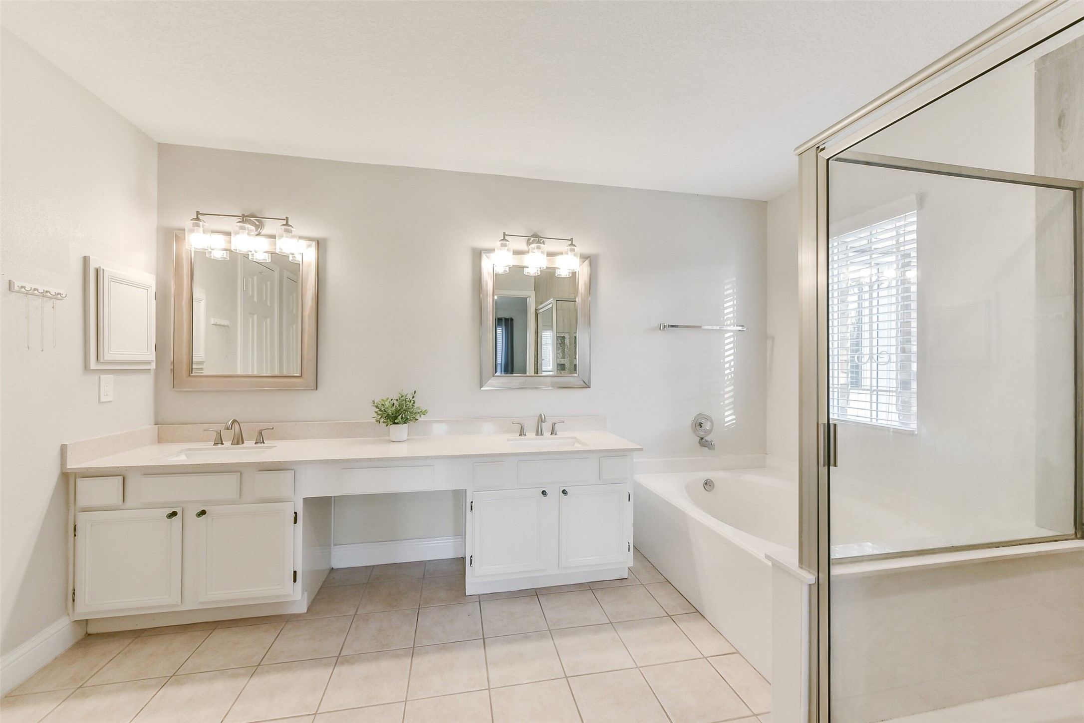 4010 Spring Branch Drive West Pearland, TX 77584 - Photo 23 of 35 a large bathroom with a large tub sink vanity and granite