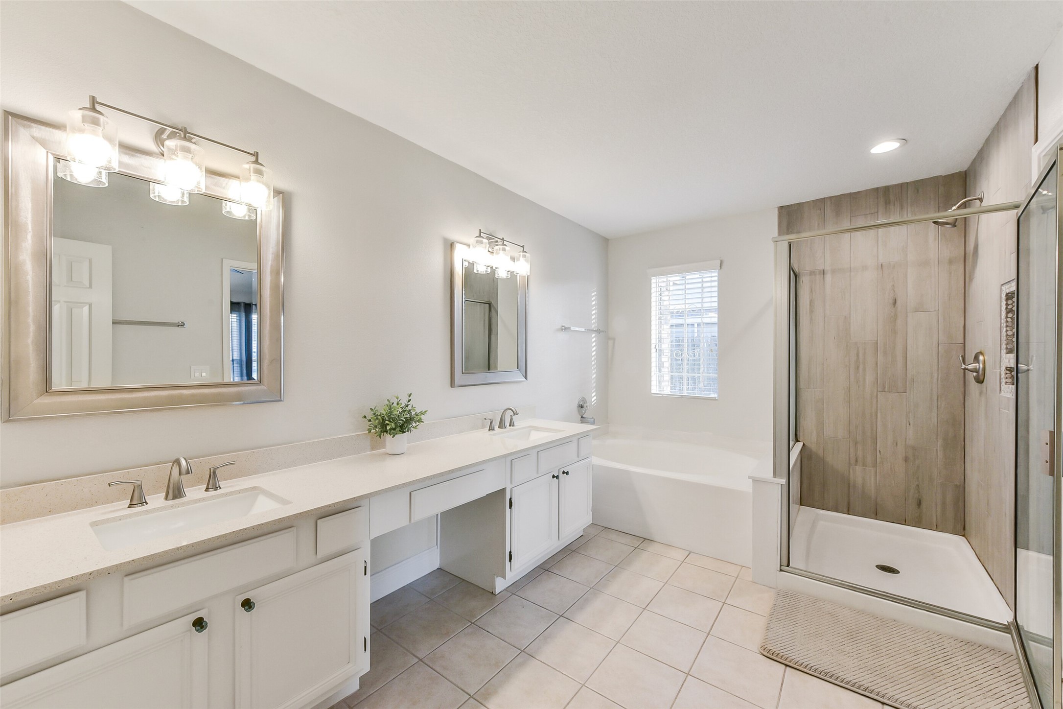 4010 Spring Branch Drive West Pearland, TX 77584 - Photo 26 of 35 a bathroom with a double vanity sink mirror and shower