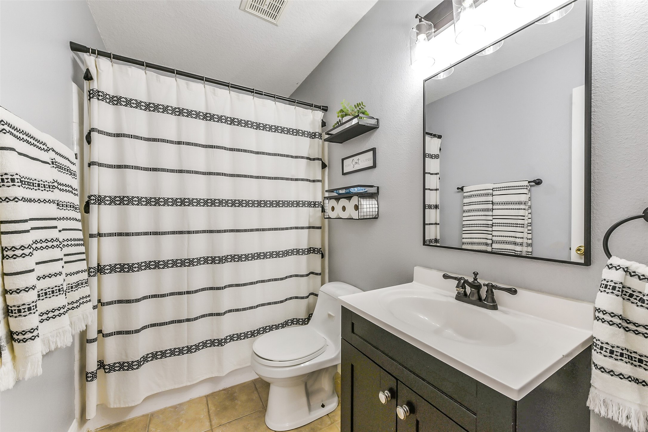 4010 Spring Branch Drive West Pearland, TX 77584 - Photo 31 of 35 a bathroom with a sink toilet and shower