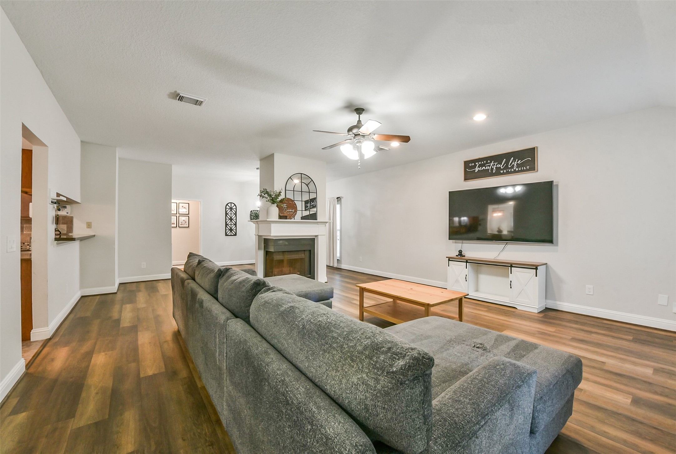 4010 Spring Branch Drive West Pearland, TX 77584 - Photo 6 of 35 a living room with furniture and a flat screen tv