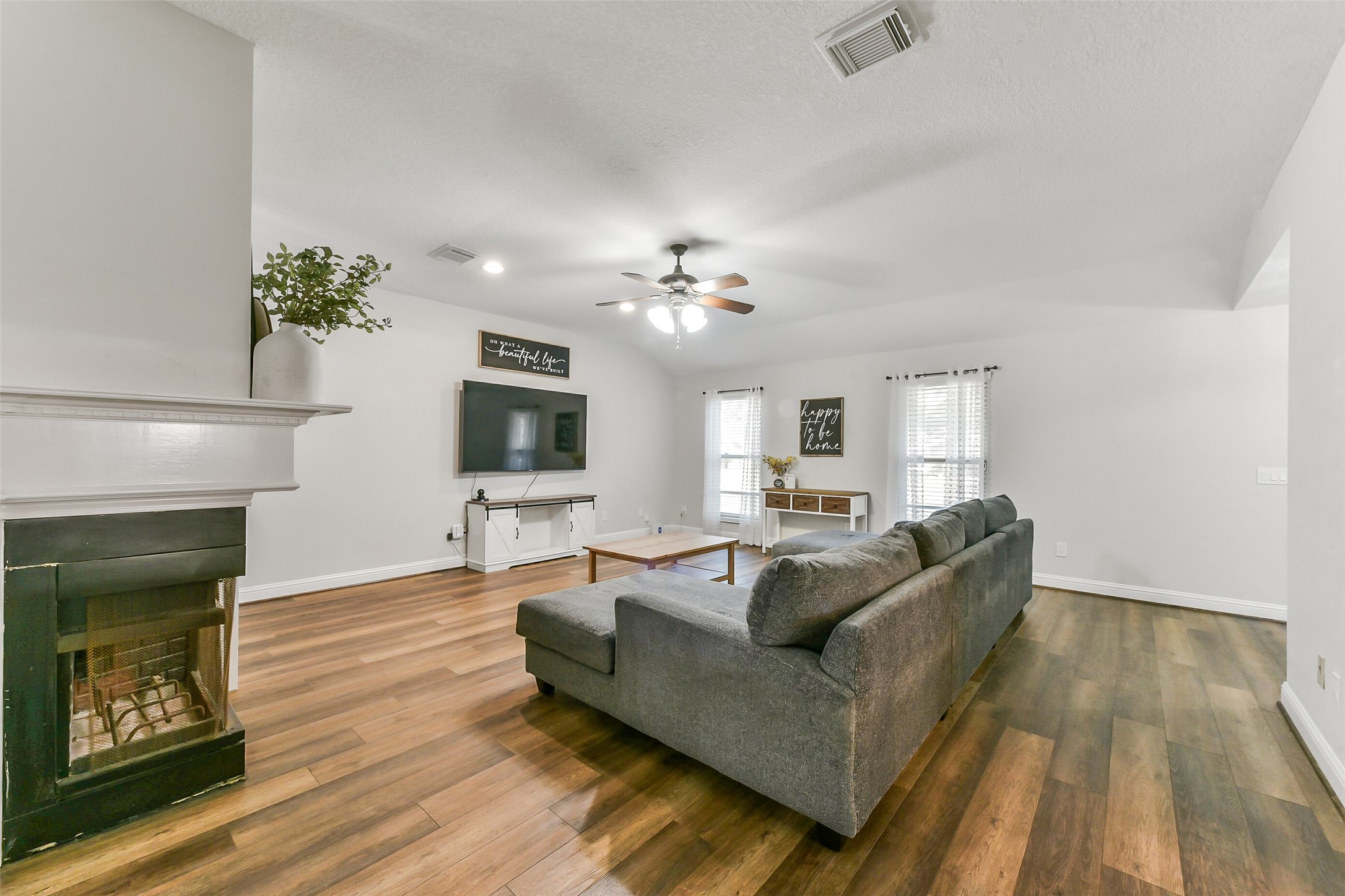 4010 Spring Branch Drive West Pearland, TX 77584 - Photo 7 of 35 a living room with furniture and a fireplace