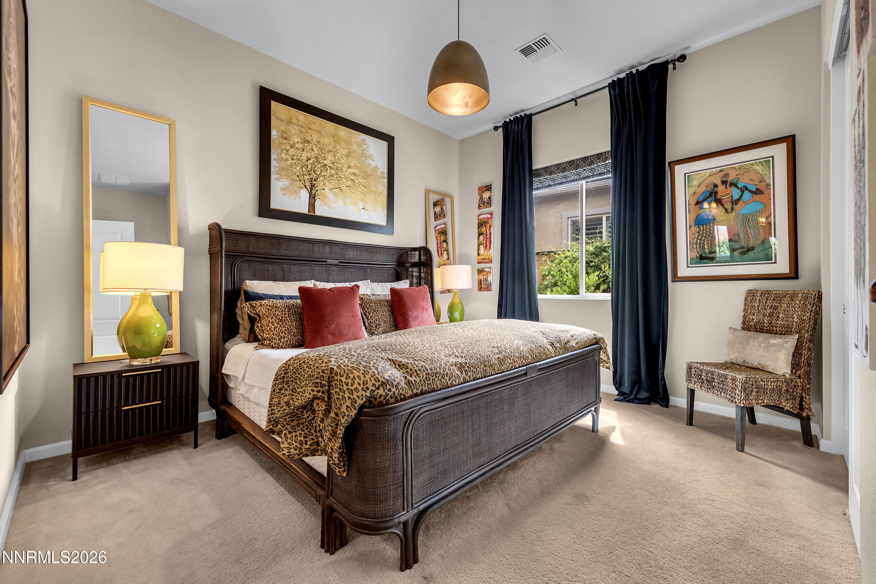 9021 Iron Sky Court Reno, NV 89523 - Photo 22 of 39 a bed sitting in a bedroom next to a window