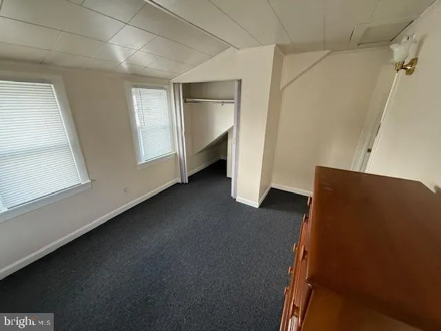 a view of an empty room and a window