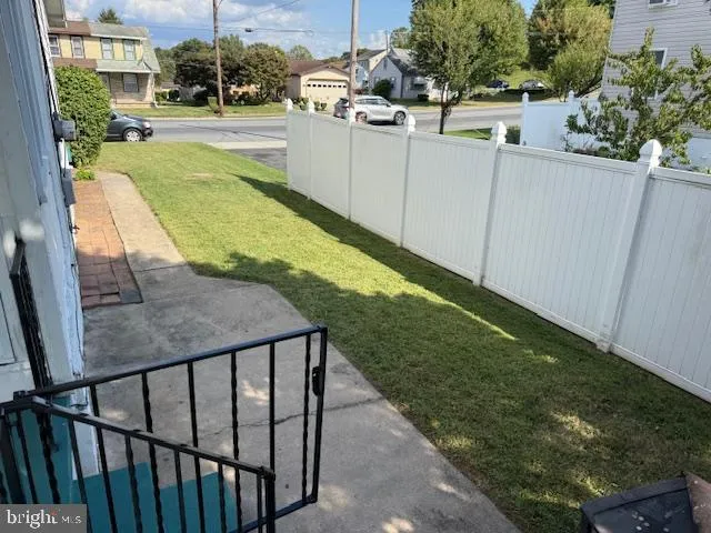 a view of a backyard with sitting area