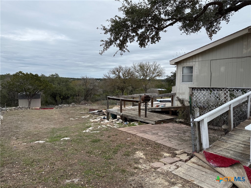 10080 Rebecca Creek Road Spring Branch, TX 78070 - Photo 4 of 16 a view of a house with backyard and sitting area