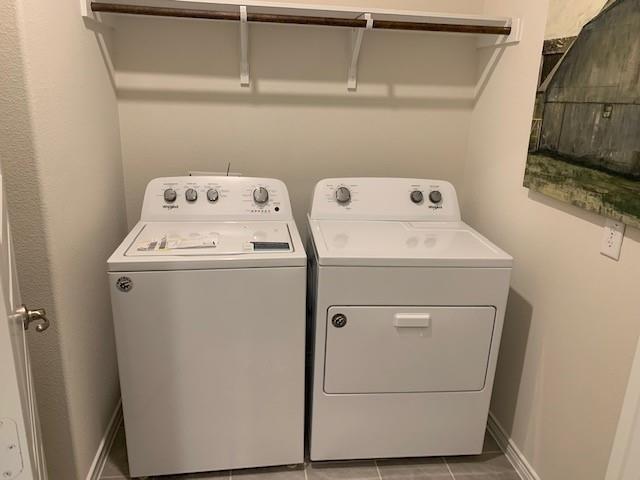 712 Feldspar Way Princeton, TX 75407 - Photo 2 of 12 Dedicated laundry space featuring a white top-load washer and front-load dryer