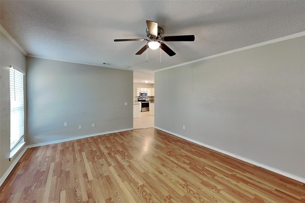 604 Ashby Place Allen, TX 75002 - Photo 8 of 21 wooden floor in an empty room with a window