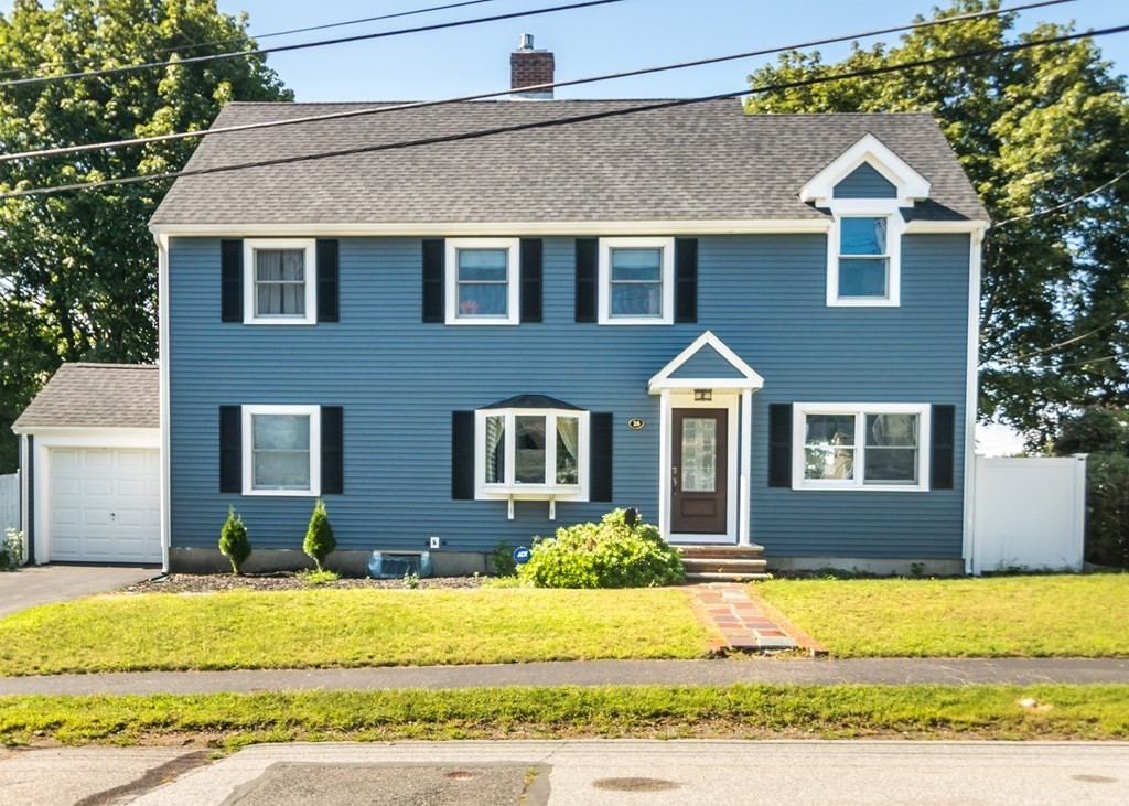 26 Grosvenor Road Waltham, MA 02453 - Photo 1 of 35 a front view of a house with a yard