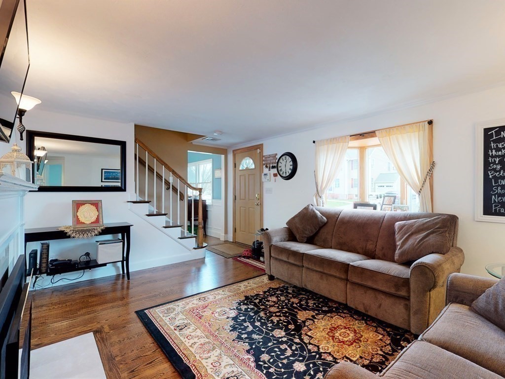26 Grosvenor Road Waltham, MA 02453 - Photo 11 of 35 a living room with furniture and a rug